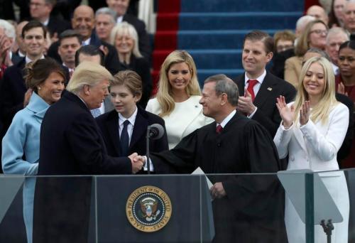 U.S. President Donald Trump shakes hands with U.S. Supreme Court Chief Justice John Roberts during inauguration ceremonies at the Capitol in Washington